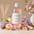 Recarga de ambientador mikado Pétalo Oriental de Naturcera, botella de 1 L con los ingredientes de su aroma